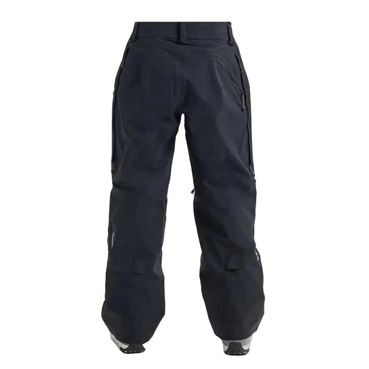 Black snowboard pants shown from the back on a model, featuring a high waist, zippered side pockets, and a relaxed, baggy fit.