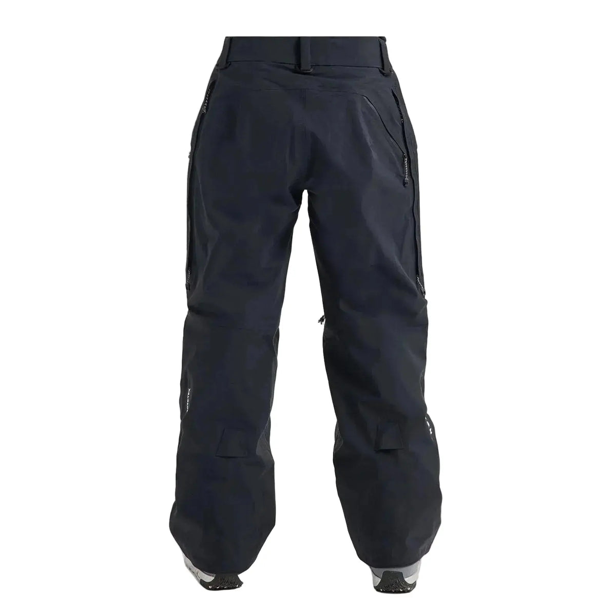 Black snowboard pants shown from the back on a model, featuring a high waist, zippered side pockets, and a relaxed, baggy fit.